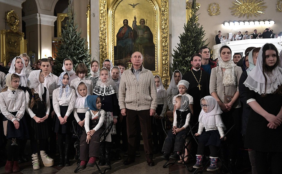 On Christmas Eve Vladimir Putin attended a service at the Transfiguration Cathedral in St Petersburg.