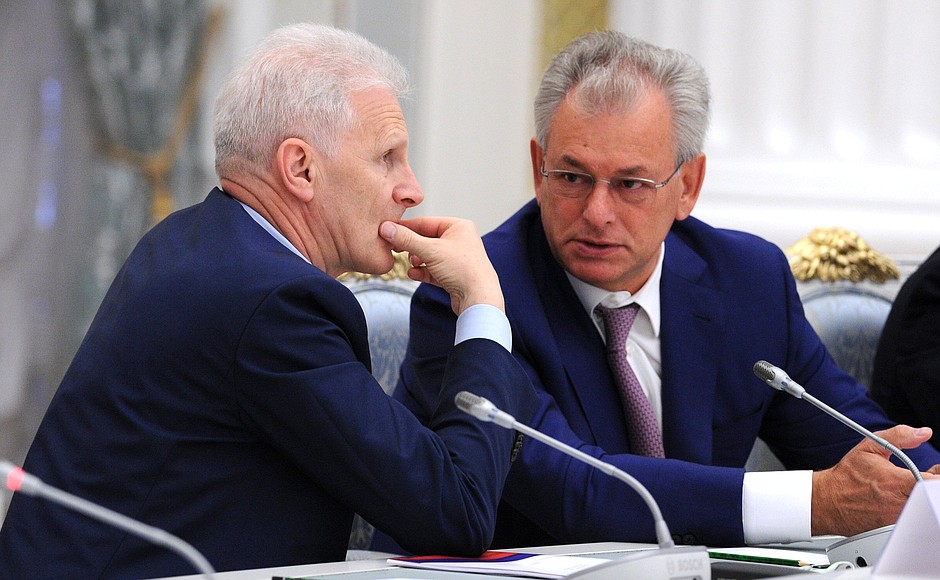 Presidential Aide Andrei Fursenko (left) and State Duma deputy Nikolai Bulayev before the start of a meeting of the Presidential Council for Science and Education.