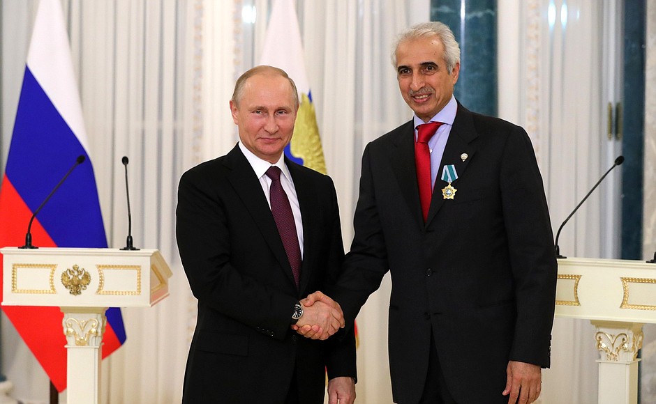 Meeting with members of the International Advisory Board of the Russian Direct Investment Fund (RDIF) and representatives of the international investment community. Vladimir Putin awards the Order of Friendship to Member of the Board of Directors of Kuwait Investment Authority (KIA) Bader Mohammad Al-Saad.