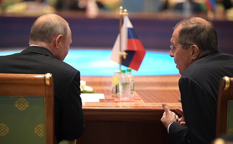 With Foreign Minister Sergei Lavrov before an expanded meeting of the CIS Heads of State Council.