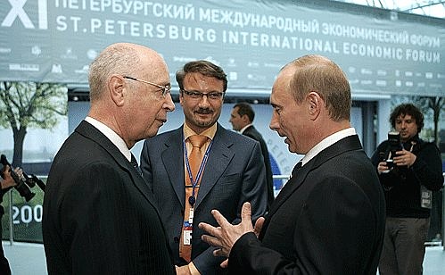 With chairman of the board of directors of the World Economic Forum in Davos Klaus Schwab.