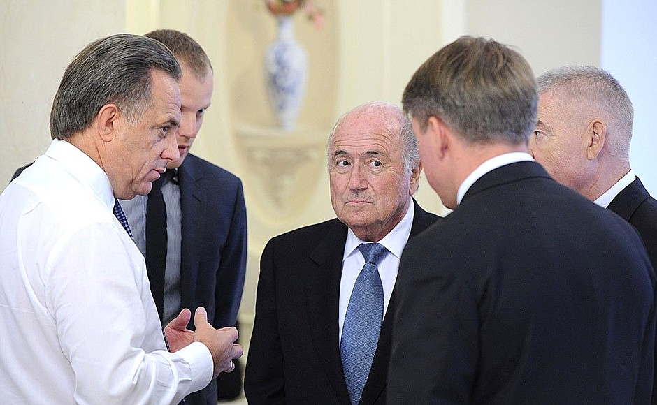 International Federation of Association Football (FIFA) President Joseph Blatter and Sports Minister Vitaly Mutko (left) before the meeting with Vladimir Putin.
