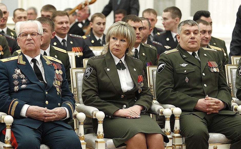 Retired major general Ivan Zyukin, who received the Order of Friendship, and warrant officer Viktoria Zabozhenko, who received the Order of Courage, during the ceremony presenting state decorations at the Kremlin.