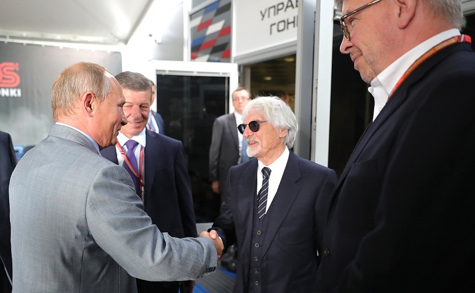 At the Formula 1 Russian Grand Prix auto race. With honorary president of Formula One Management and Formula One Administration Bernie Ecclestone (center), Formula One Managing Director of Motorsports Ross Brawn (right), and Russian Deputy Prime Minister Dmitry Kozak.