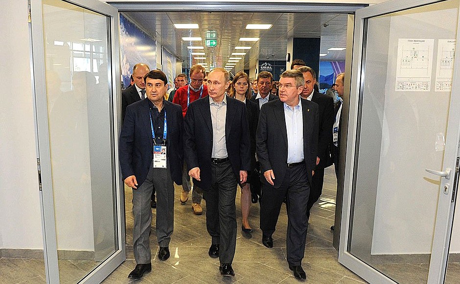During visit to exposition of Russian regions at the Olympic Park. With Presidential Aide Igor Levitin (left) and President of the International Olympic Committee Thomas Bach.
