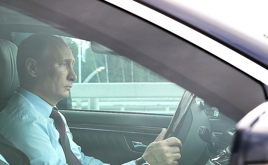 Vladimir Putin arrives for the opening of the northern section of the Western High-Speed Diameter.