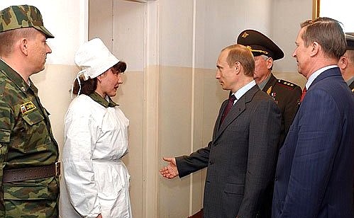 President Putin at a medical station of the 201st Motorised Rifle Division with Russia\'s Defence Minister Sergei Ivanov (right).