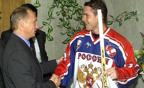 President Vladimir Putin with Russian ice hockey team captain Pavel Bure at the Russian-Czech Spartak Cup match.