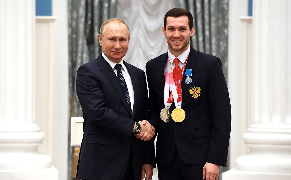 Presenting state decorations to winners of the 2020 Summer Paralympic Games in Tokyo. Denis Tarasov, swimming champion and silver medallist of the Paralympics, receives the Order of Honour.