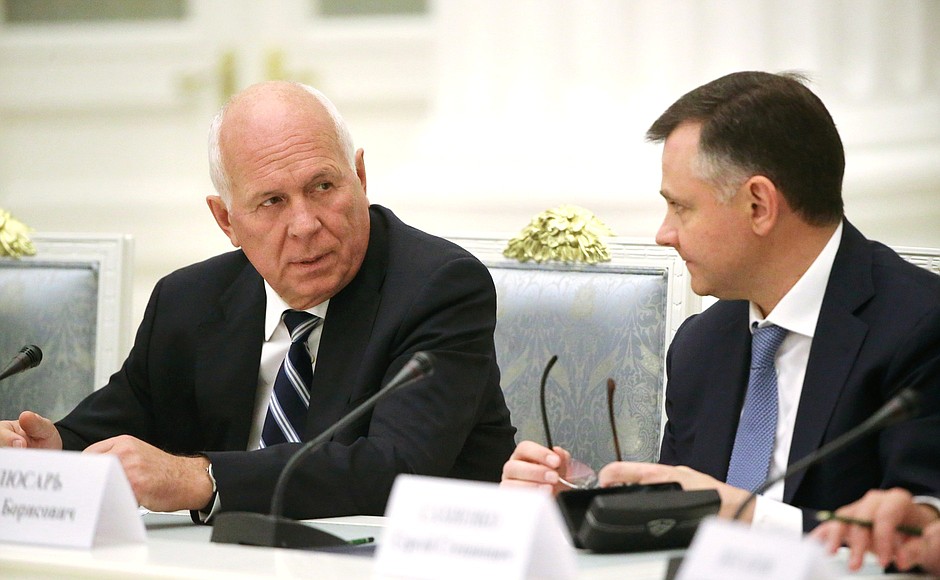 Rostec State Corporation Director General Sergei Chemezov and United Aircraft Corporation Director General Yury Slyusar, right, before a meeting with heads of defence industry enterprises.