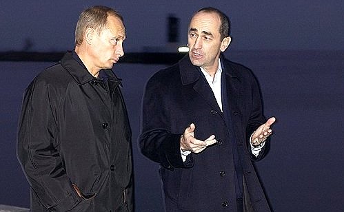 President Putin strolling with Armenian President Robert Kocharian along the embankment.