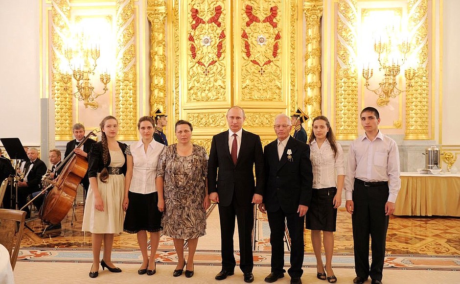 Presenting the Order of Parental Glory to Margarita and Alexander Bagin, who are raising 10 children.