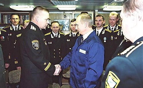 Russian Navy adopting new Gepard nuclear-powered submarine. President Putin with submarine commander Captain First Class Dmitry Kosolapov.
