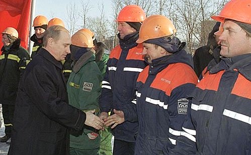 At the unveiling ceremony for a new section of Moscow\'s Third Ring Road. Vladimir Putin congratulates the builders on their achievement.