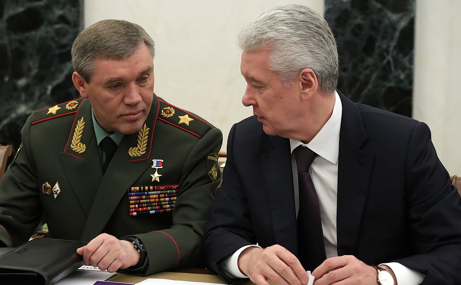 Chief of the General Staff of the Russian Armed Forces and First Deputy Defence Minister Valery Gerasimov, left, and Moscow Mayor Sergei Sobyanin before a Security Council meeting.