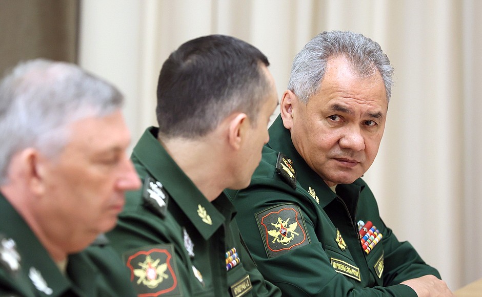 Defence Minister Sergei Shoigu (right).