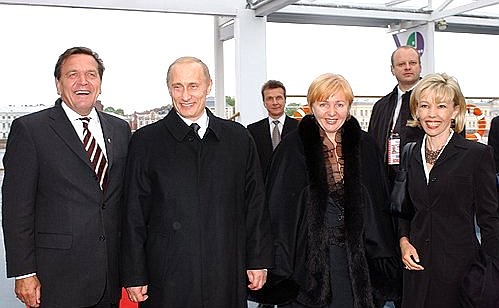 President Putin with German Chancellor Gerhard Schroeder and his wife, Doris Schroeder-Koepf (far right) and Lyudmila Putina.