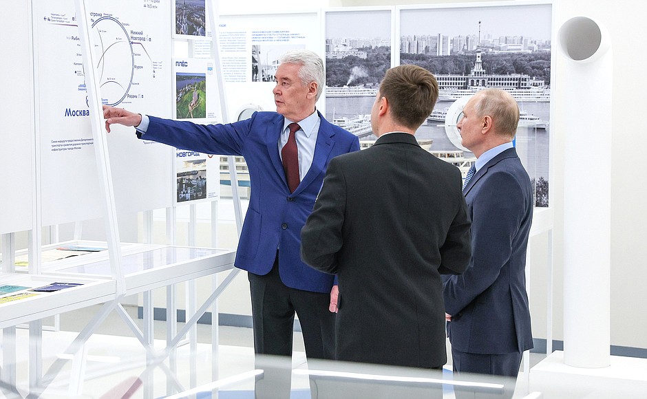 With Moscow Mayor Sergei Sobyanin (left) and Director of the North River Terminal subdivision of Mosgortrans Maxim Lisin (second left) while touring “The Moskva River: The Moscow Golden Ring” exhibition inside the North River Terminal building.