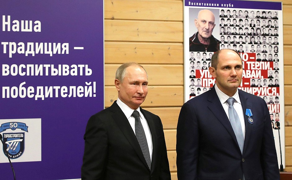 Vladimir Putin presents state awards to club athletes and former members during his visit to Turbostroitel Club. Club President Mikhail Rakhlin receives the Order of Honour.