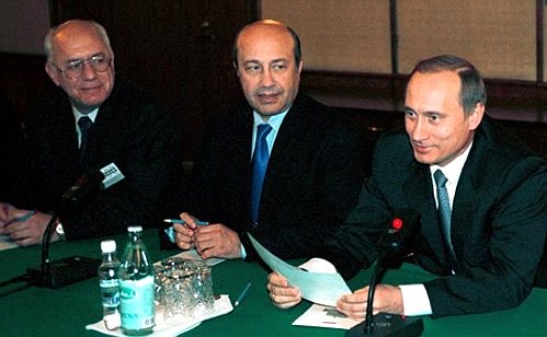 Acting President Vladimir Putin meeting with German businessmen and bankers. Vladimir Putin with Russian Foreign Minister Igor Ivanov (centre) and Economics Minister Andrei Shapovalyants.