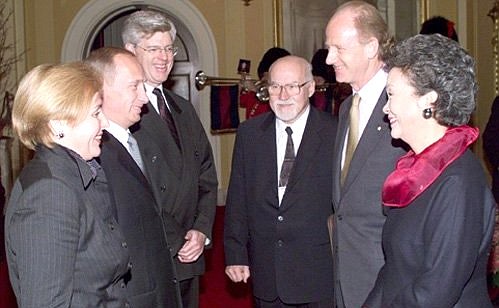 Adrienne Clarkson, the Governor General of Canada, and her husband with Vladimir and Lyudmila Putin at an official ceremony.