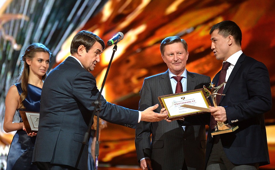 At the 2015 Russian Olympians Ball. Awards ceremony. Left to right: Aide to the President Igor Levitin, Chief of Staff of the Presidential Executive Office Sergei Ivanov, and Greco-Roman wrestler, Olympic Champion, Twice World and European Champion Roman Vlasov.