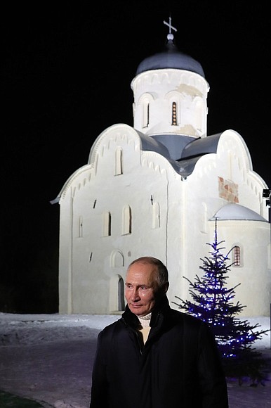 Vladimir Putin answers a journalist’s question following Christmas mass.