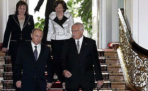 With Czech President Vaclav Klaus. In the background are the Presidents\' wives, Lyudmila Putina (left) and Livia Klausova.