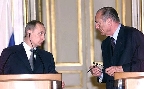 President Putin with French President Jacques Chirac during a final news conference at the end of the negotiations.