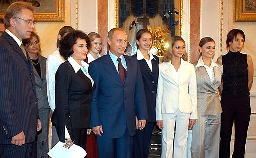 President Putin with members of the Russian rhythmic gymnastics team and tennis player Anastasia Myskina.