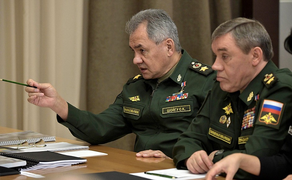 Before a meeting with Defence Ministry leadership and defence industry heads. Defence Minister Sergei Shoigu (left) and Chief of the General Staff – First Deputy Defence Minister Valery Gerasimov.