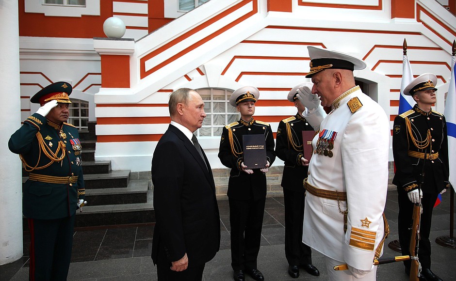 Before the ceremony for the signing of the Executive Order On Approving the Naval Doctrine of the Russian Federation, and the Executive Order On Approving the Russian Navy Regulations. With Defence Minister Sergei Shoigu and Commander-in-Chief of the Russian Navy Nikolai Yevmenov (right).