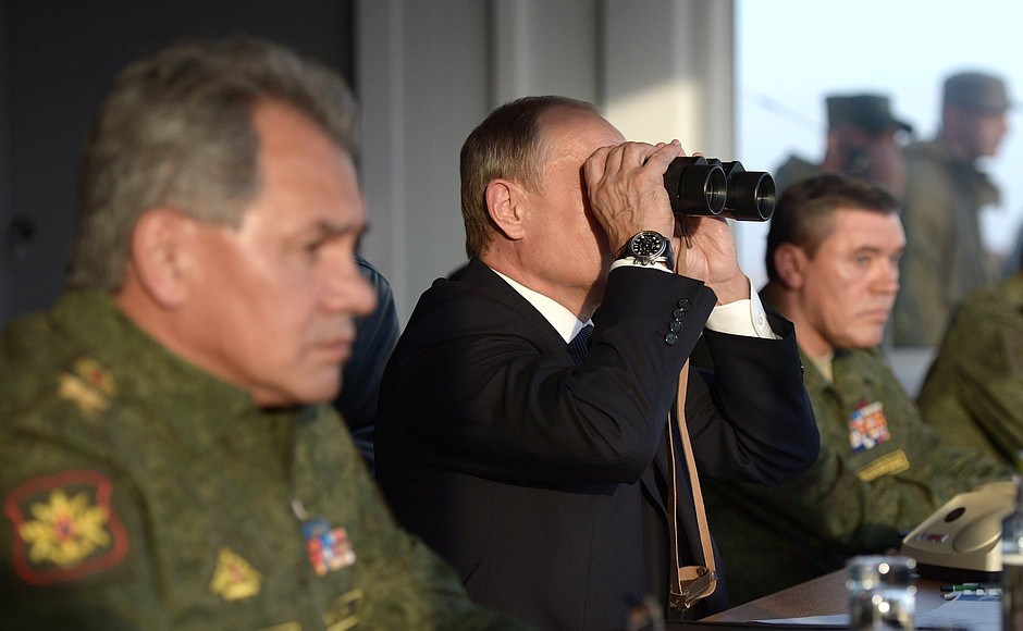 At the Donguzsky Test Ground during the final stage of the Tsentr-2015 strategic headquarters military exercises. With Defence Minister Sergei Shoigu and Valery Gerasimov, Chief of the General Staff of the Armed Forces of the Russian Federation, first Deputy Minister of Defence of the Russian Federation (right).