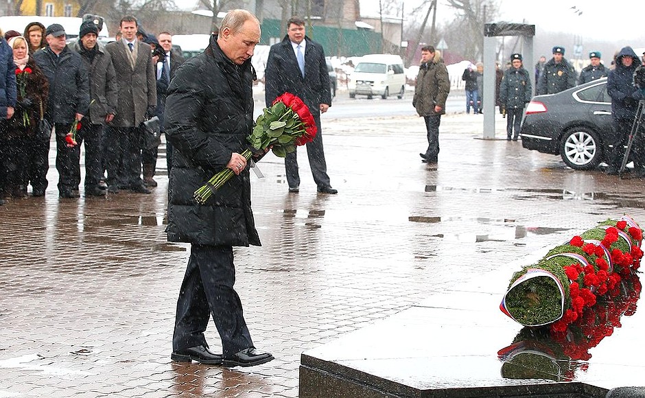Laying flowers at a memorial to paratroopers, who died heroically in action during an operation in the North Caucasus in 2000.