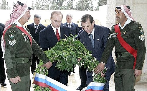 Laying wreaths on the tombs of Jordanian kings.