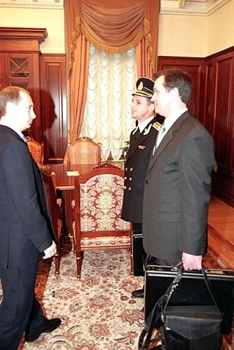 Acting President Vladimir Putin receiving the “nuclear briefcase” for controlling Russia\'s nuclear forces.