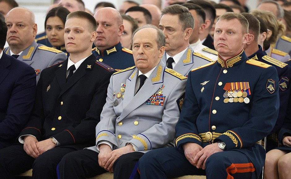 Before a meeting with graduates of higher military schools. Director of the Federal Security Service Alexander Bortnikov (centre).