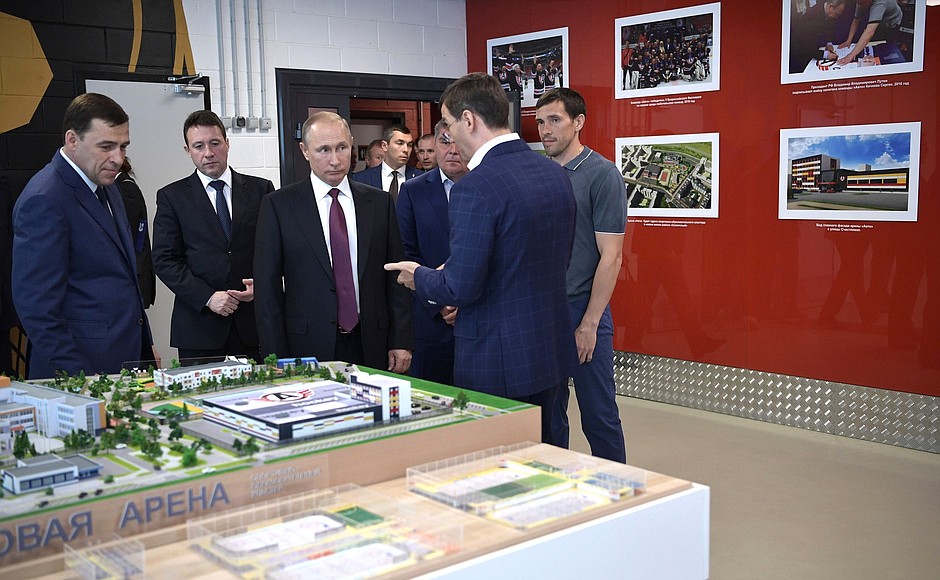 During his visit to the Datsyuk Arena sports complex, Vladimir Putin inspects a scale model of the sports and educational cluster to be constructed in Yekaterinburg's new neighbourhood.
