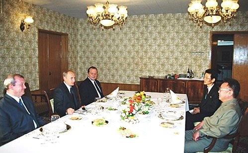 President Putin at a dinner with Kim Jong-Il, Chairman of the National Defence Commission of North Korea.