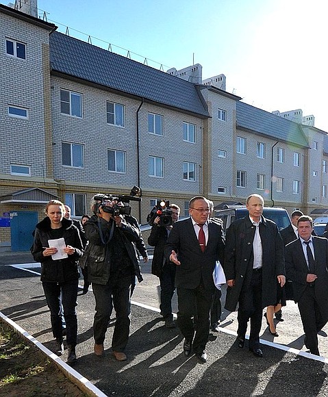 With Mayor of Elista Artur Dzhordzhiyev during a visit to a new block of flats in Elista.