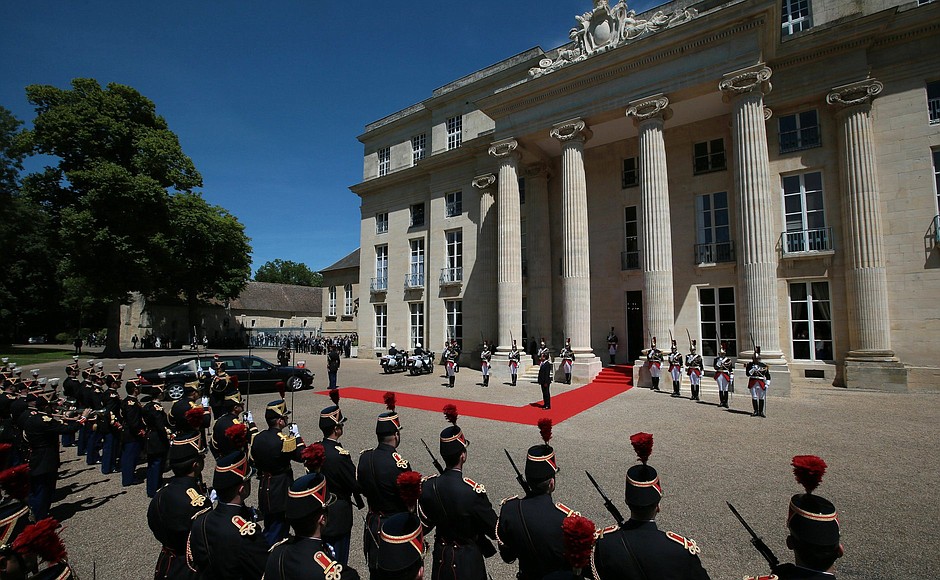 Before the start of an official breakfast hosted by the French President to mark the 70th anniversary of the allied forces’ D-Day landing in Normandy.