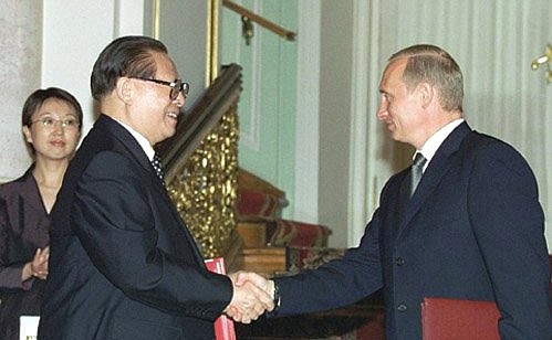 President Putin with Chinese President Jiang Zemin at a document-signing ceremony.