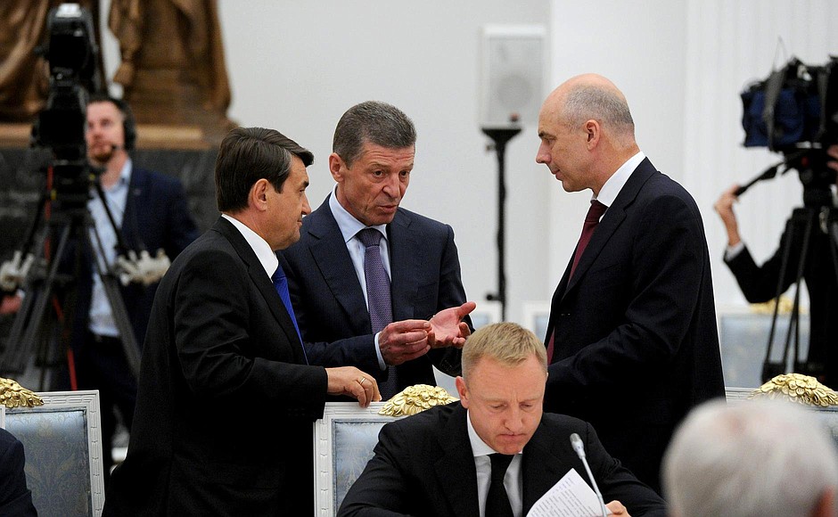 Before the meeting of the Council for Strategic Development and Priority Projects. Standing (from left to right): Presidential Aide Igor Levitin, Deputy Prime Minister Dmitry Kozak, Finance Minister Anton Siluanov. Sitting: Education and Science Minister Dmitry Livanov.