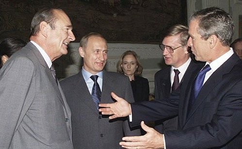 President Vladimir Putin with French President Jacques Chirac and US President George W. Bush before a morning meeting of the G8 summit at the Doge\'s Palace (Palazzo Ducale).