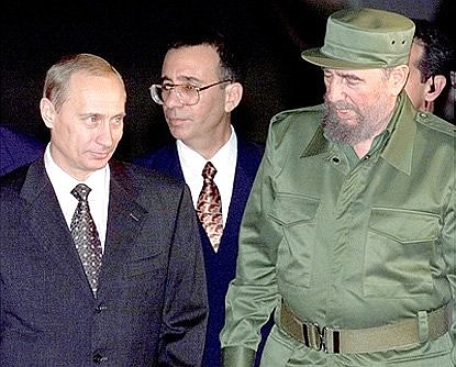 President Vladimir Putin with Cuban leader Fidel Castro during a welcoming ceremony at the airport.