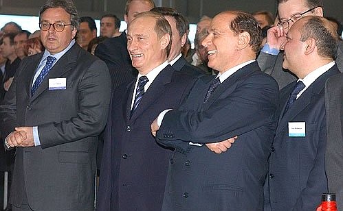 With Italian Prime Minister Silvio Berlusconi at a washing machine factory.