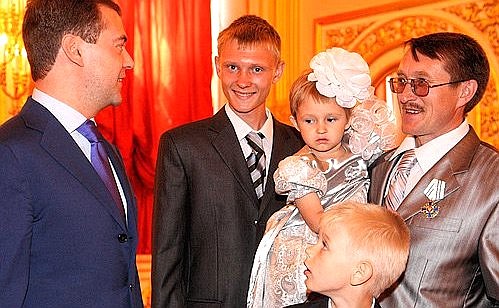 With Vladimir Belyaev, recipient of the Order of Parental Glory, and his children.