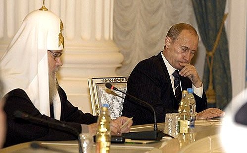 At a meeting of the Presidential Council for coordination with religious organisations. On the left, the Patriarch of Moscow and all Russia, Alexii II.