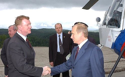 President Putin arriving at the Bureyskaya hydropower plant. He is welcomed by Anatoly Chubais, Chairman of the Board of Unified Energy Systems of Russia.