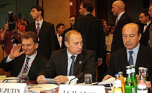 President Putin at a meeting of the Russia-European Union summit with Russian Foreign Minister Igor Ivanov, right, and Deputy Prime Minister Viktor Khristenko.